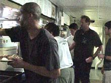 The ship's crew in the serving line at dinnertime.