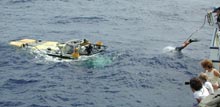 sub crew member Jim Sullivan dives from the R/V Seward Johnson to the JSL II