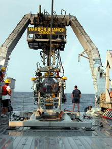 JSL being recovered; if you look really hard, you can see a rainbow arching to the right of the sub between it and the A-frame.