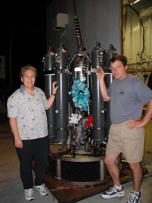 Geoff, Sharon and the backpack buddies are securing the mesh bags with the cups to the CTD frame 