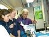 Students view live squat lobsters collected during the cruise