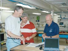 John McDonough, Jeff Ellett, and Will Schroeder discuss the ROV dive schedule 