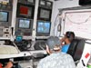 Sonsub technicians at the controls of the ROV in the control van