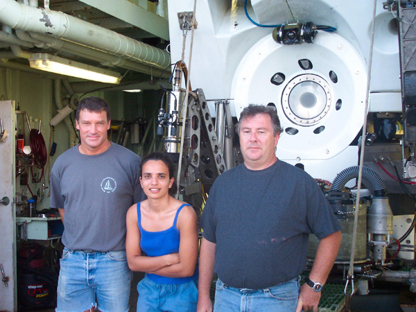 Alvin pilot in training, Mark Spear, Georgia Tech graduate student Alex Rao, and Alvin expedition leader, Pat Hickey standing in front of DSV Alvin.