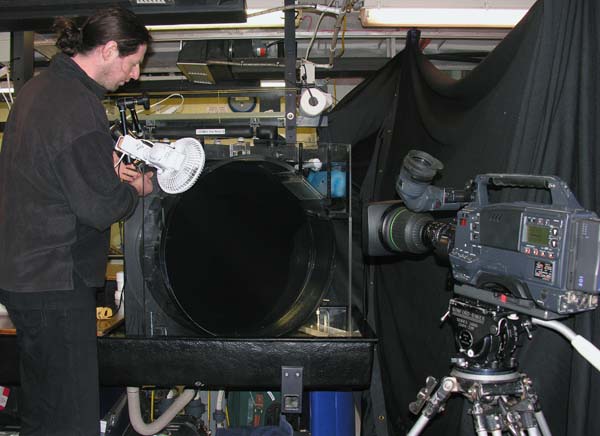 Warwick adjusts the light through the round kreisel tank in preparation for filming mid water animals. 