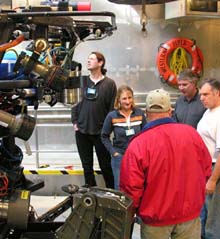 Penny and Warwick from the BBC confer with MBARI scientist Jim Barry and ROV pilots Buck Reynolds and Buzz Scott about lighting modifications that will show off the HD images to their fullest.