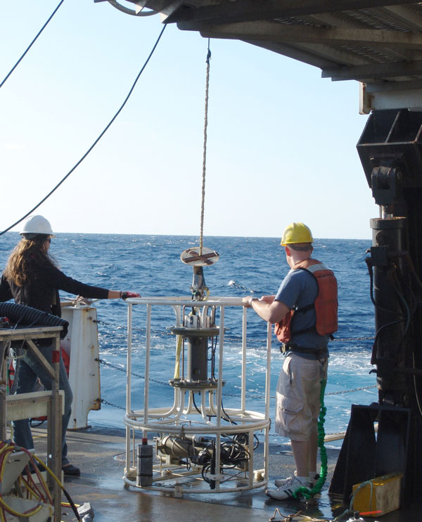 Jay helps Senior Survey Technician Missy Partyka retrieve the conductivity-temperature-depth (CTD) logger. 