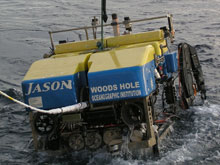 Jason surfaces carrying samples and artifacts.