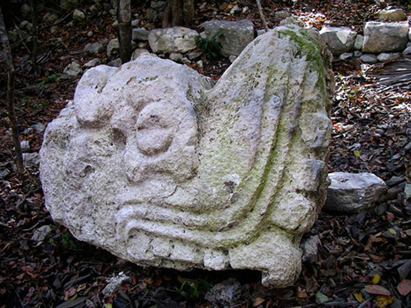 View the Mission Summary The carved serpent head found at the base of Vista Alegre’s temple structure.