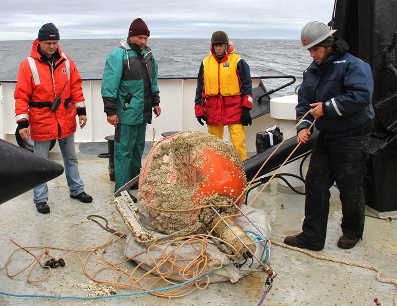 A barnacle-covered mooring on deck.