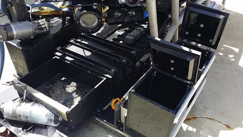 What the ROV looks like once it has hit the deck and the scientists descend upon it to collect all of the samples recovered from bottom