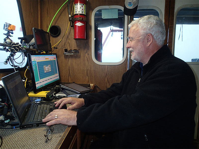 Jim Delgado monitoring the output from the magnetometer.