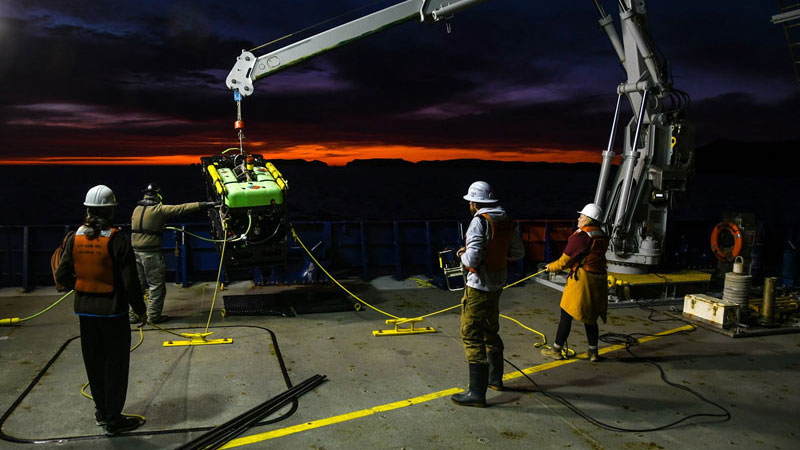 The Student Explorations Around Southern California: Acoustics, Paleolandscapes, and Environments at Sea (SEASCAPES) project science team and Research Vessel Sally Ride crew deploy remotely operated vehicle Beagle for a dive off Anacapa Island.