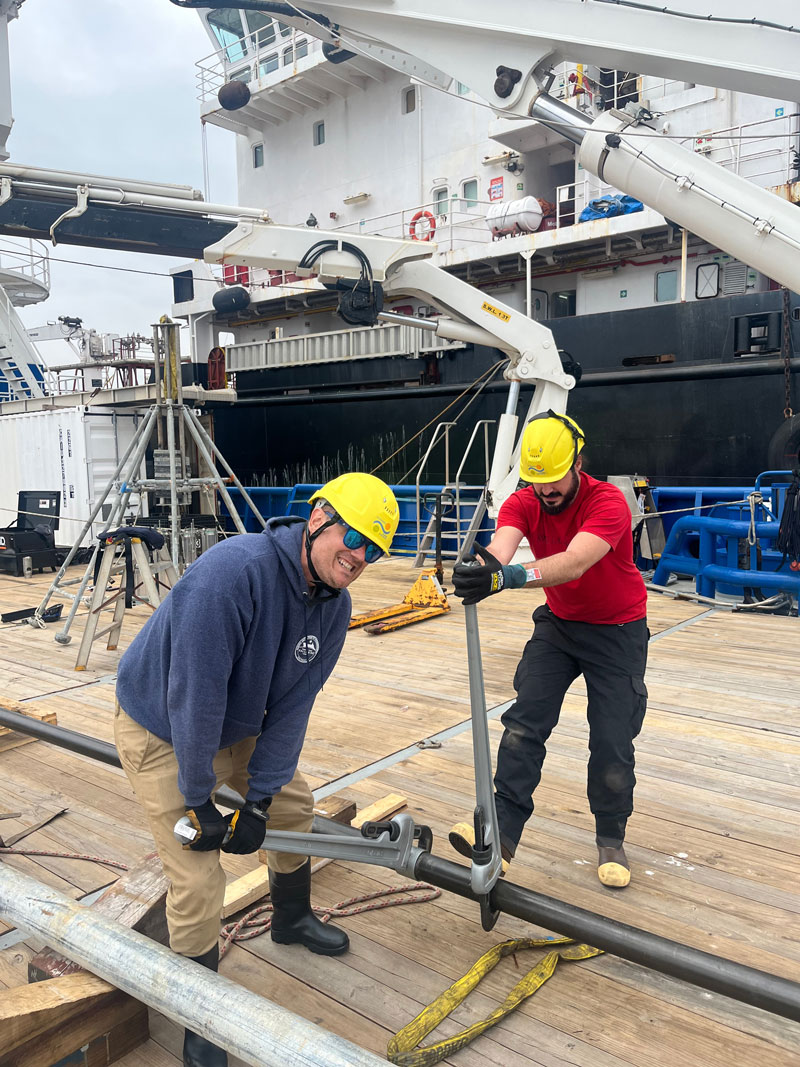 Exploring Deep-Sea Methane Seeps Along the Chile Margin project principal investigator Jeff Beeson (left) and Davide Oppo (right) joining gravity coring pipe together in preparation for deployment of the corer.