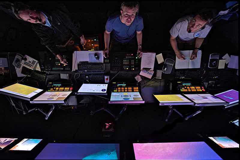 Left-to-Right: Dave Wright, Tom Kok, and Brian Bingham look up for a moment while operating the ROV. Every day presents the pilot, co-pilot, and navigator with new and unforeseen challenges.