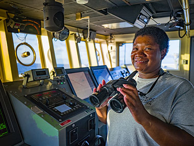 GVA Nicky Applewhite stands the lookout watch as we map our way to our next dive site.