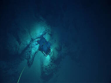 View from Seirios as remotely operated vehicle Deep Discoverer gets a closer look at a ferromanganese-encrusted outcrop.