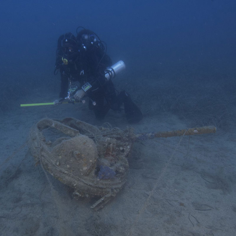 Closed-circuit diver investigating a gun turret from a World War II U.S. Army Air Force bomber. Closed-circuit diving systems allow technical divers to dive deeper and stay down longer.