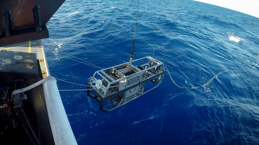 Remotely operated vehicle Seirios being lowered into the ocean